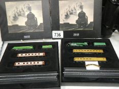 Two boxed Atlas Editions miniature model trains.