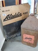 An Aladdin Pink sign and a paraffin can. Collect only.