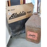 An Aladdin Pink sign and a paraffin can. Collect only.