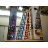 Two boxed Christmas trees and a quantity of wrapping paper.