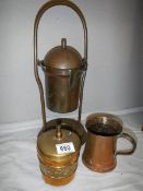 A copper pot and two other items.