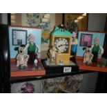 Three Wallace and Gromit clocks.