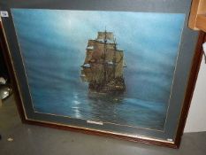 A large framed and glazes seascape print.