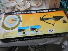 A boxed Pistol cross bow with safety lock.