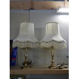 A pair of 20th century brass table lamps with shades.