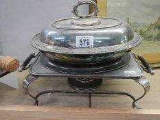 A silver plate tureen and a food warmer with burner.