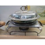 A silver plate tureen and a food warmer with burner.