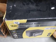 A boxed Yale safe. Collect only.