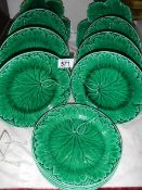 Twelve green leaf plates including Wedgwood.