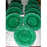 Twelve green leaf plates including Wedgwood.