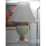A ceramic table lamp with shade.