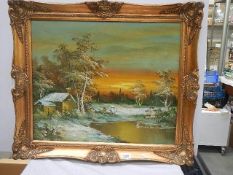 A signed gilt framed winter scene.