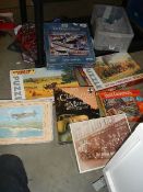 A quantity of jig saw puzzles.