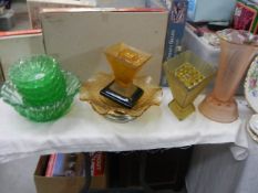 A mixed lot of coloured glass ware including green glass fruit set, vases etc.