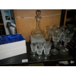 A decanter and glasses.