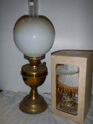An oil lamp and a boxed table lamp.