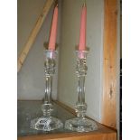 A pair of glass candlesticks.