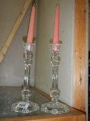 A pair of glass candlesticks.