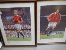 Two framed and glazed photographs of David Beckham and Ryan Giggs.