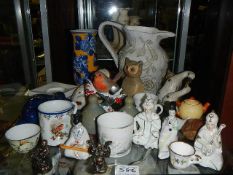 A mixed lot including oriental figures, Buddha's, vases etc.