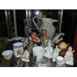 A mixed lot including oriental figures, Buddha's, vases etc.