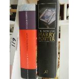 A First Edition Harry Potter and the Half Blood Prince (printing error) and one other book.