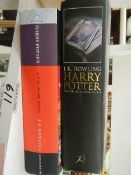 A First Edition Harry Potter and the Half Blood Prince (printing error) and one other book.