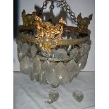 A small old chandelier featuring cherubs. ****Condition report**** Missing droppers.