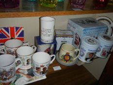 A mixed lot of commemorative mugs.