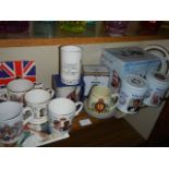 A mixed lot of commemorative mugs.