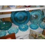A mixed lot of blue glass bowls.