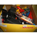 A box of scalextric items.