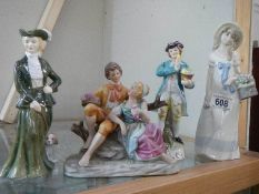 Three porcelain figures and a figure group.