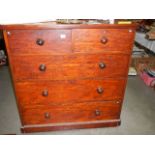 A two over three mahogany chest of drawers.