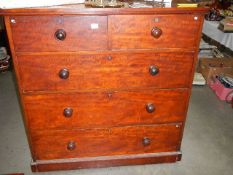 A two over three mahogany chest of drawers.