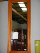 A pine framed mirror.