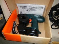 A boxed Black and Decker drill.