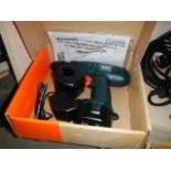 A boxed Black and Decker drill.