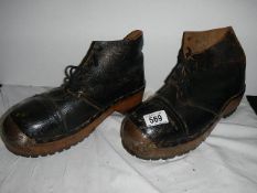 A pair of old steel toecap boots.