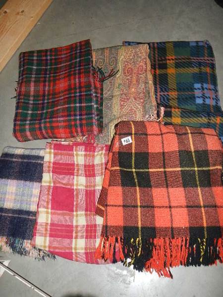 A quantity of picnic blankets.