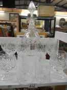 A cut glass decanter and assorted glasses.