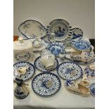 A good lot of blue and white plates, dishes, Ringtons storage jar etc.