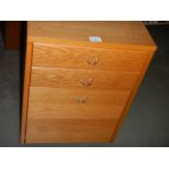 A teak effect filing cabinet. (collect only).