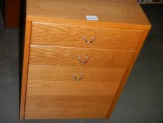 A teak effect filing cabinet. (collect only).