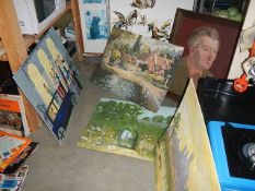 A quantity of unframed paintings.