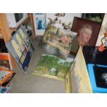 A quantity of unframed paintings.