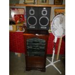 A music centre in cabinet and with speakers. (collect only).