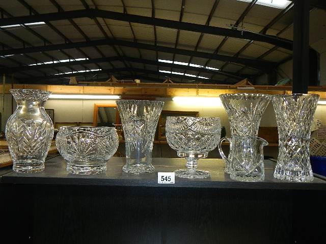 Four cut glass vases and two bowls.