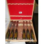 A cased set of six wood chisels.