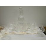 A cut glass decanter and assorted glasses.